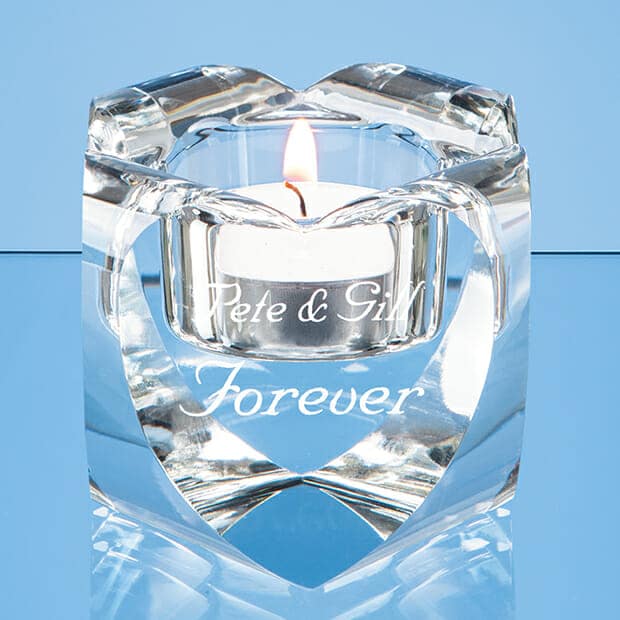 lit candle in engraved crystal tealight